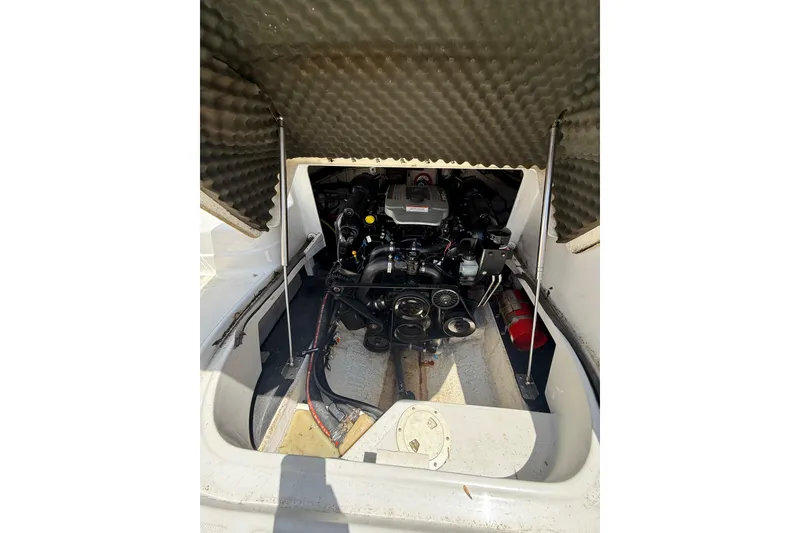 Slide: The Image of Engine compartment of a 2011 Crownline 236 SC boat, showing detailed mechanical components. - 30
