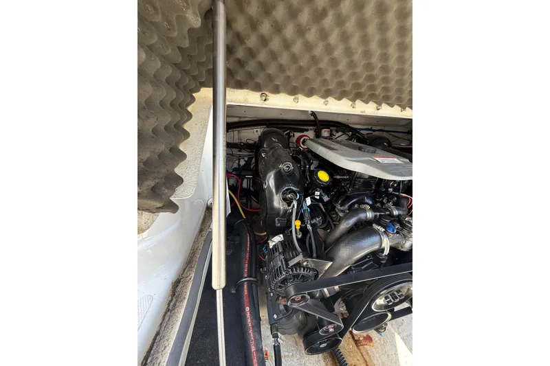 Slide: The Image of Engine compartment of a 2011 Crownline 236 SC boat, showcasing detailed components. - 32