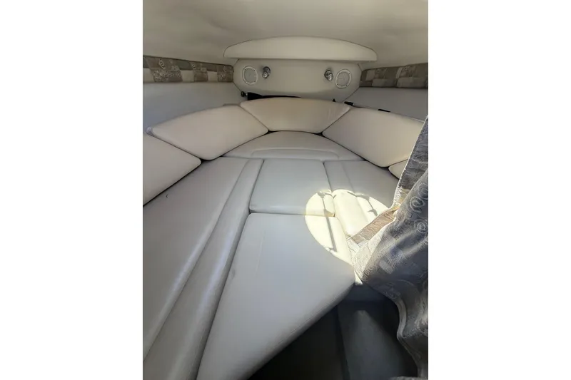 Slide: The Image of Interior cabin of 2011 Crownline 236 SC boat with cushioned seating. - 43