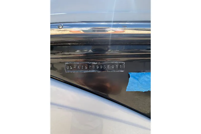 Slide: The Image of 2011 Crownline 236 SC boat hull identification number (HIN) displayed on black surface. - 7