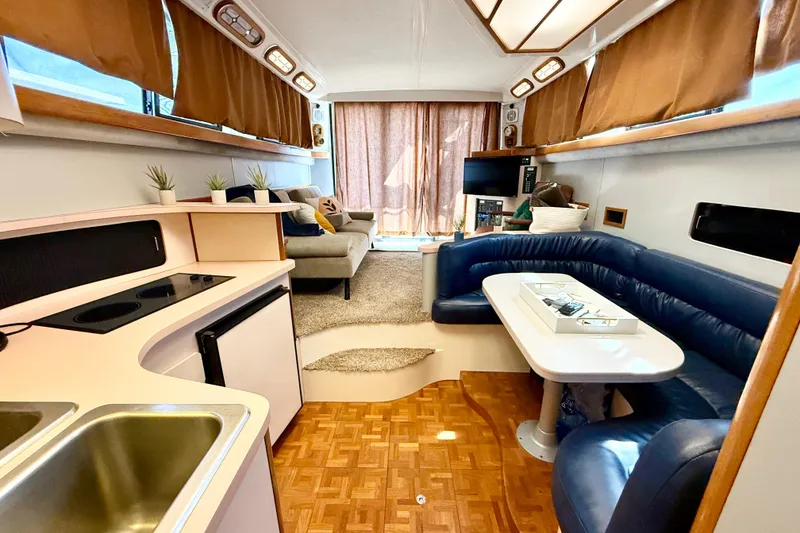 Slide: The Image of Interior of 1990 Luhrs 3400 Motor Yacht with cozy seating and modern amenities. - 21
