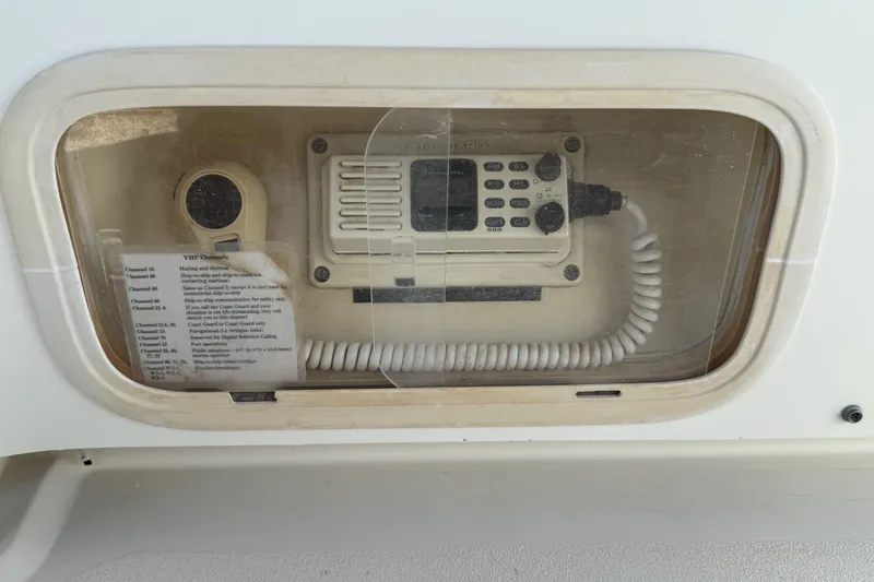 Slide: The Image of VHF radio system on 1990 Luhrs 3400 Motor Yacht, enclosed in protective casing. - 35