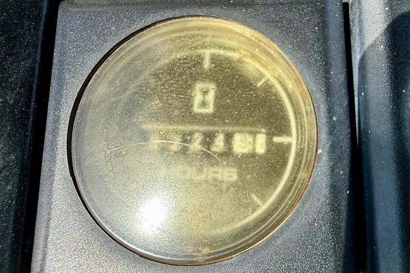 Slide: The Image of Hour meter display on 1990 Luhrs 3400 Motor Yacht dashboard. - 36