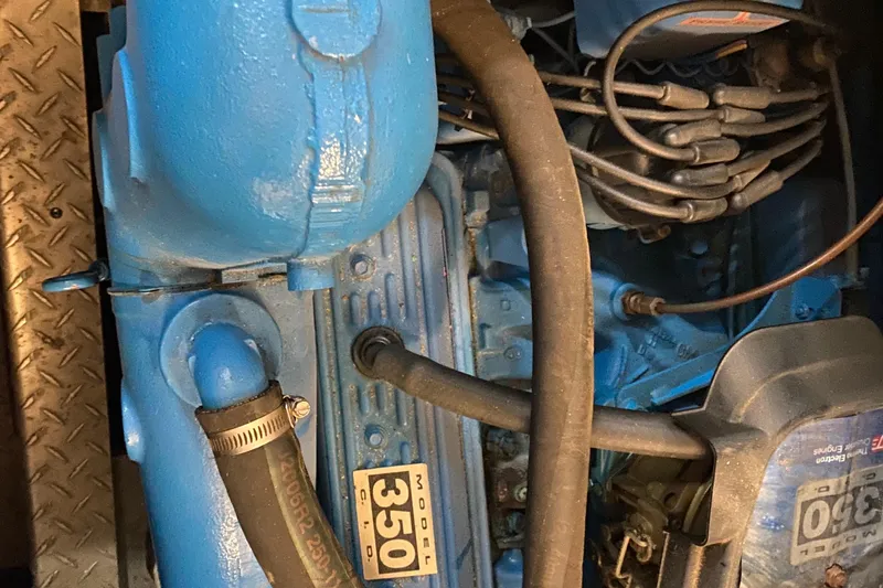 Slide: The Image of Engine of a 1990 Luhrs 3400 Motor Yacht, featuring a blue 350 model. - 37