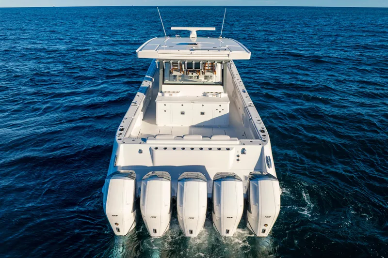 Slide: The Image of 2027 HCB 56 Suenos luxury boat with four powerful engines cruising on open sea. - 10