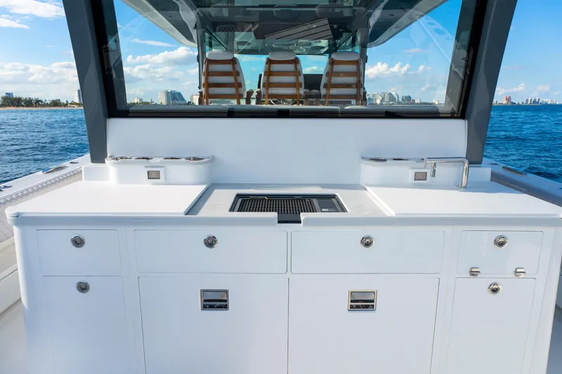 Slide: The Image of Luxury outdoor kitchen on 2027 HCB 56 Suenos yacht with ocean view. - 11