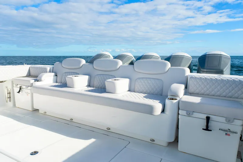 Slide: The Image of Luxury seating on 2027 HCB 56 Suenos boat with ocean backdrop. - 14