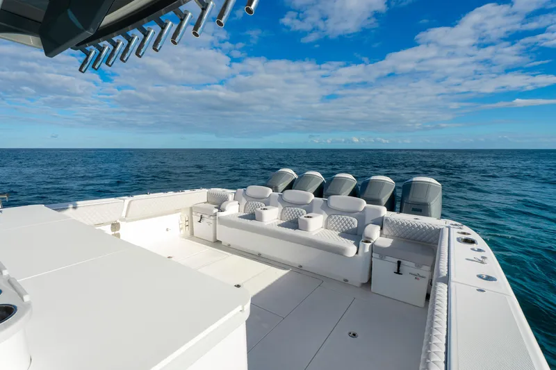 Slide: The Image of Luxury HCB 56 Suenos boat deck with seating, ocean view, and multiple engines, 2027 model. - 20