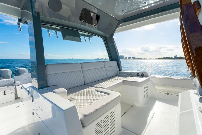 Slide: The Image of Luxurious seating area on the 2027 HCB 56 Suenos yacht, overlooking the ocean. - 21