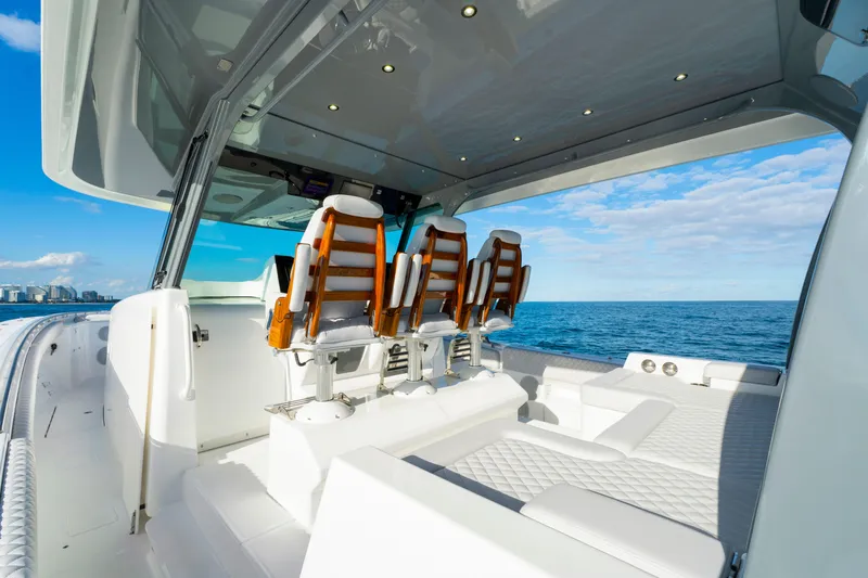 Slide: The Image of Luxurious 2027 HCB 56 Suenos yacht interior with ocean view and elegant seating. - 23