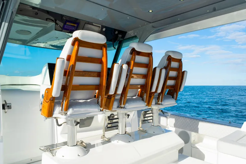 Slide: The Image of Luxury seating on 2027 HCB 56 Suenos boat, overlooking the ocean. - 24