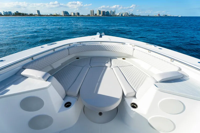 Slide: The Image of Luxurious seating on the 2027 HCB 56 Suenos yacht, with ocean and city skyline views. - 32