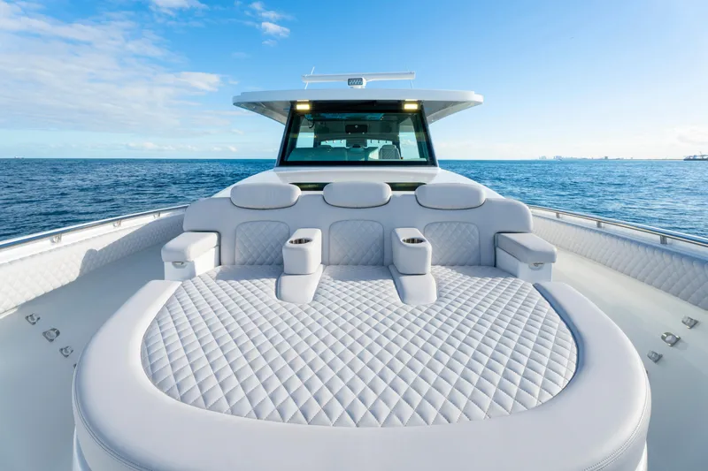 Slide: The Image of Luxurious seating on the 2027 HCB 56 Suenos yacht, cruising on open water. - 34