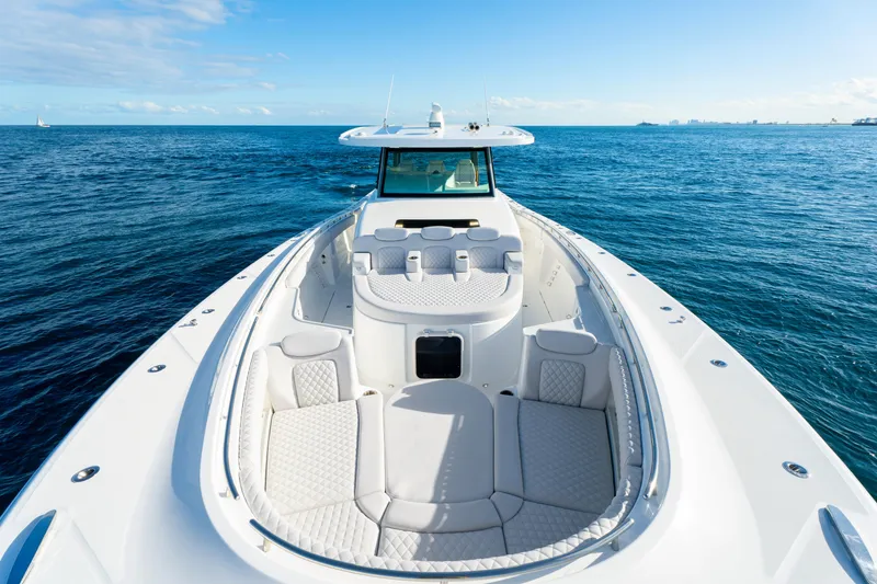 Slide: The Image of Luxurious 2027 HCB 56 Suenos yacht cruising on open ocean waters. - 37