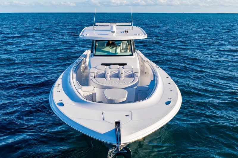 Slide: The Image of 2027 HCB 56 Suenos luxury boat cruising on open ocean waters. - 4