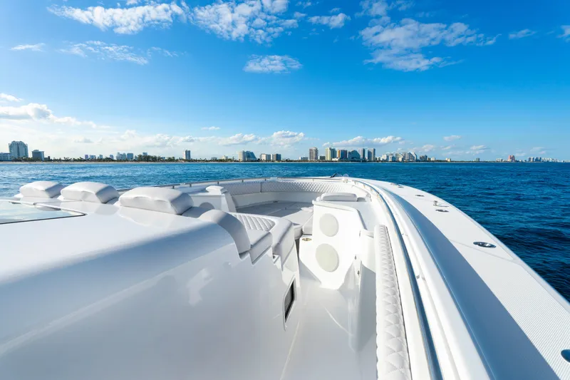 Slide: The Image of Luxury HCB 56 Suenos yacht cruising near city skyline, 2027 model. - 42