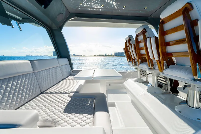 Slide: The Image of Luxurious interior of 2027 HCB 56 Suenos yacht with elegant seating and ocean view. - 46