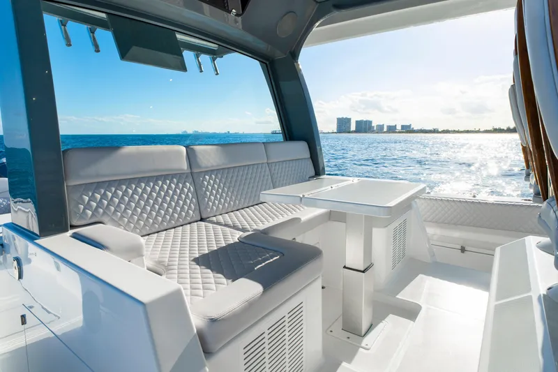 Slide: The Image of Luxurious seating area on the 2027 HCB 56 Suenos yacht, overlooking the ocean. - 47