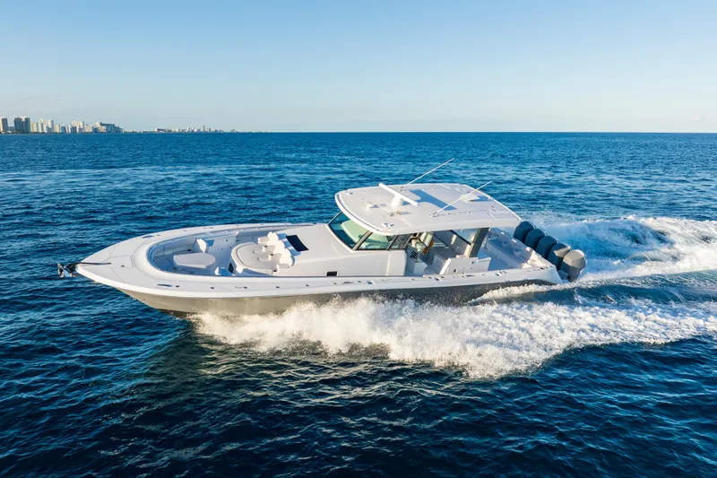 Slide: The Image of 2027 HCB 56 Suenos luxury yacht cruising on open ocean under clear blue sky. - 51