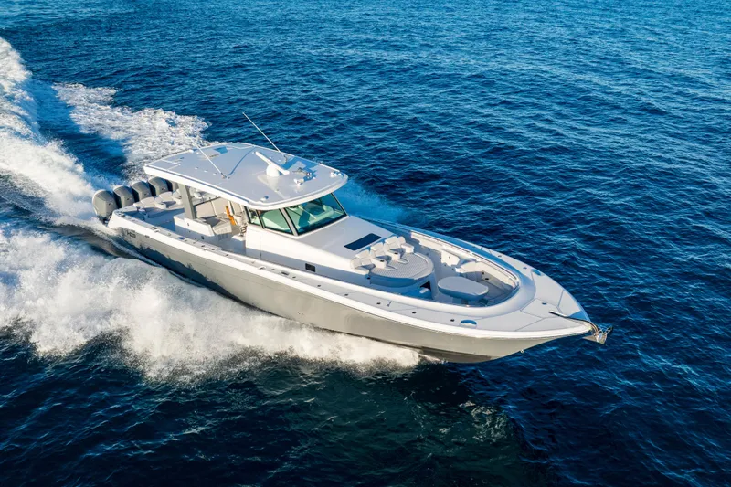 Slide: The Image of 2027 HCB 56 Suenos luxury boat cruising on open ocean waters. - 53