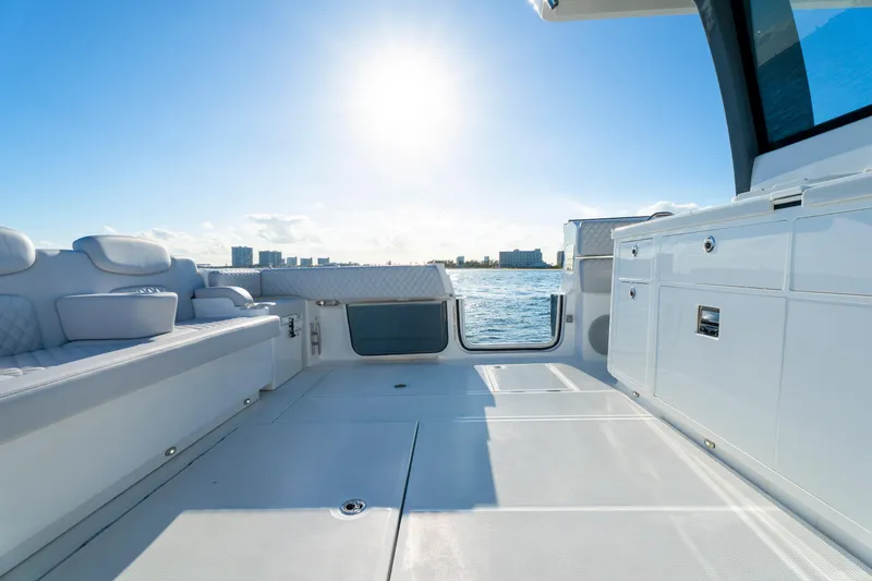 Slide: The Image of Luxurious deck of 2027 HCB 56 Suenos yacht under bright sun, overlooking ocean. - 54