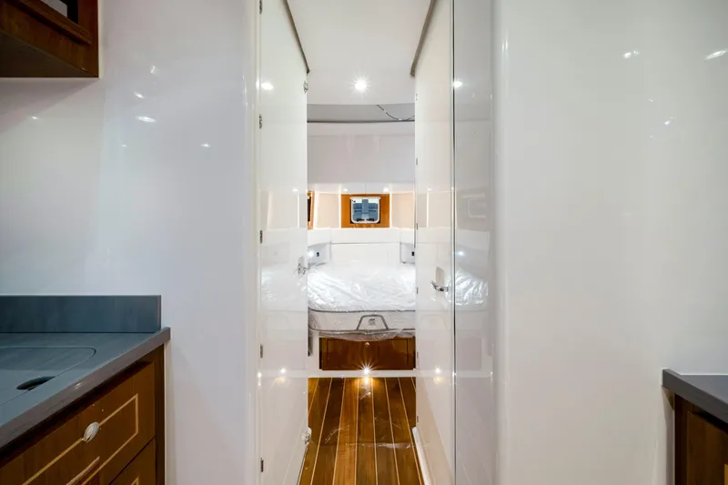 Slide: The Image of Luxurious interior of 2027 HCB 56 Suenos yacht with modern design and wood accents. - 62