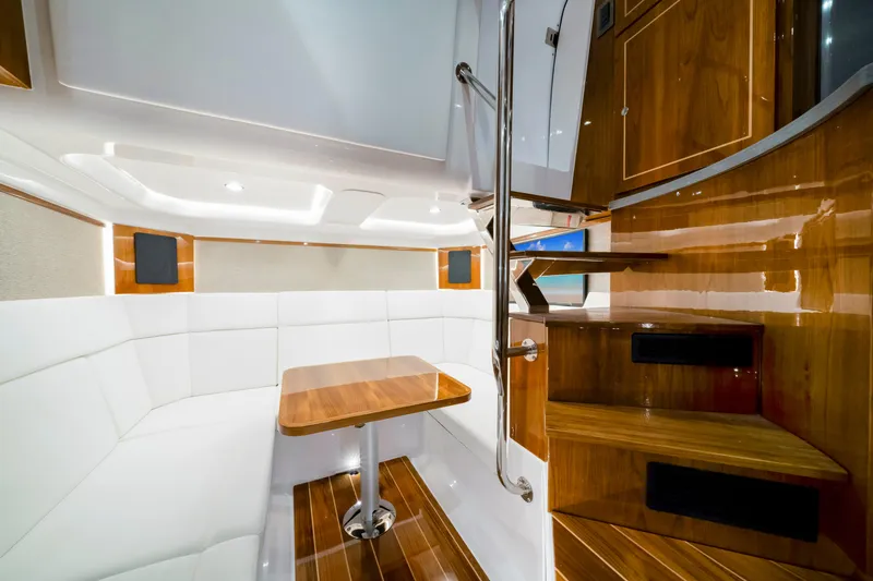 Slide: The Image of Luxurious interior of 2027 HCB 56 Suenos yacht with elegant wood finishes and seating area. - 65