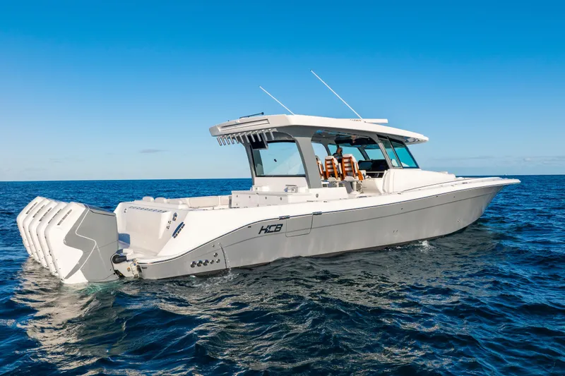 Slide: The Image of 2027 HCB 56 Suenos luxury boat cruising on open ocean waters. - 7