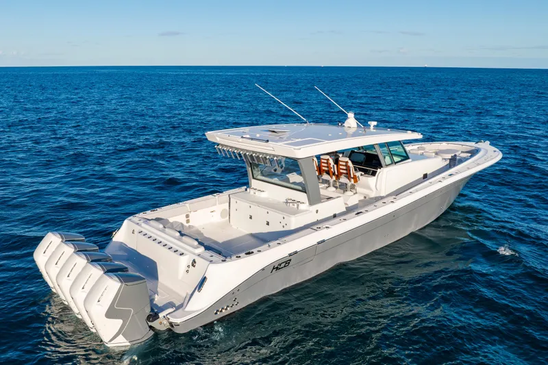 Slide: The Image of 2027 HCB 56 Suenos luxury boat cruising on open ocean waters. - 8