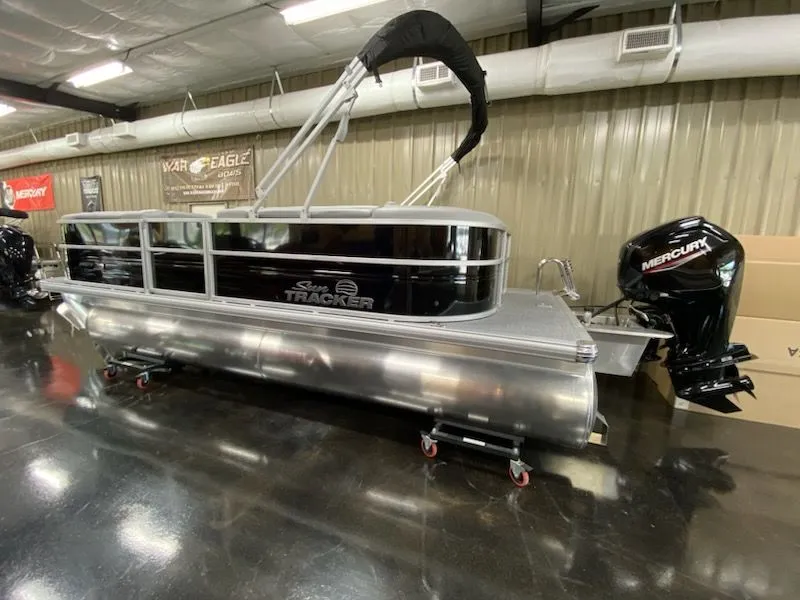 Slide: The Image of 2026 Sun Tracker Party Barge 20 DLX pontoon boat in a showroom. - 10