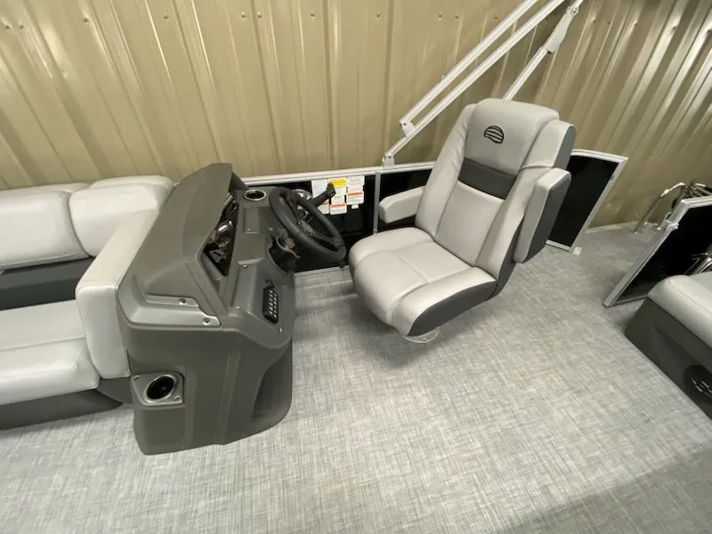 Slide: The Image of Interior of 2026 Sun Tracker Party Barge 20 DLX with helm console. - 11