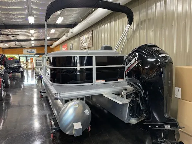 Slide: The Image of 2026 Sun Tracker Party Barge 20 DLX in showroom. - 6