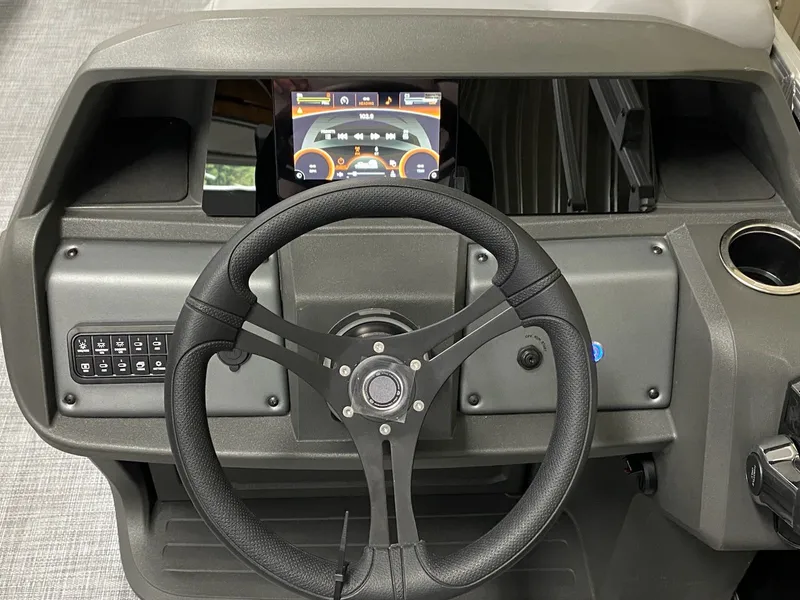 Slide: The Image of Steering wheel and dashboard of Sun Tracker Party Barge 20 DLX 2026. - 7