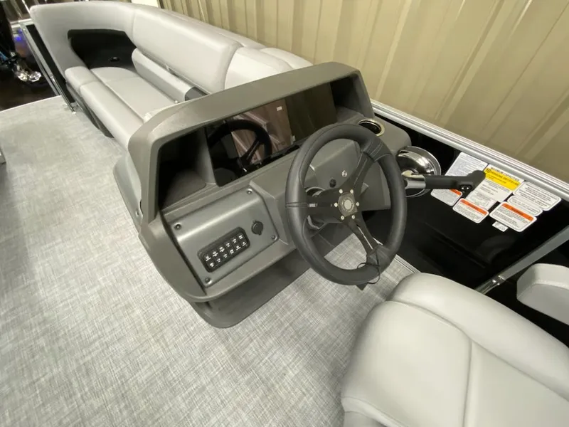 Slide: The Image of Interior view of 2026 Sun Tracker Party Barge 20 DLX helm. - 8