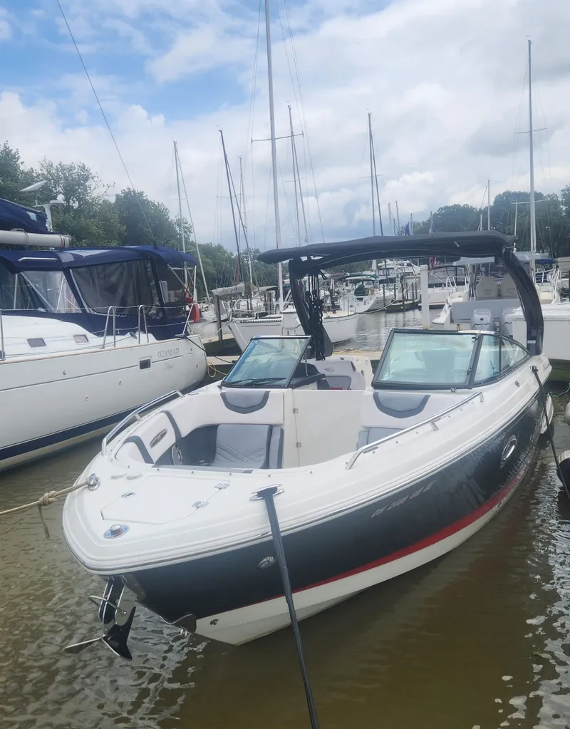 Slide: The Image of 2017 Chaparral 287 SSX boat docked, cloudy sky. - 3