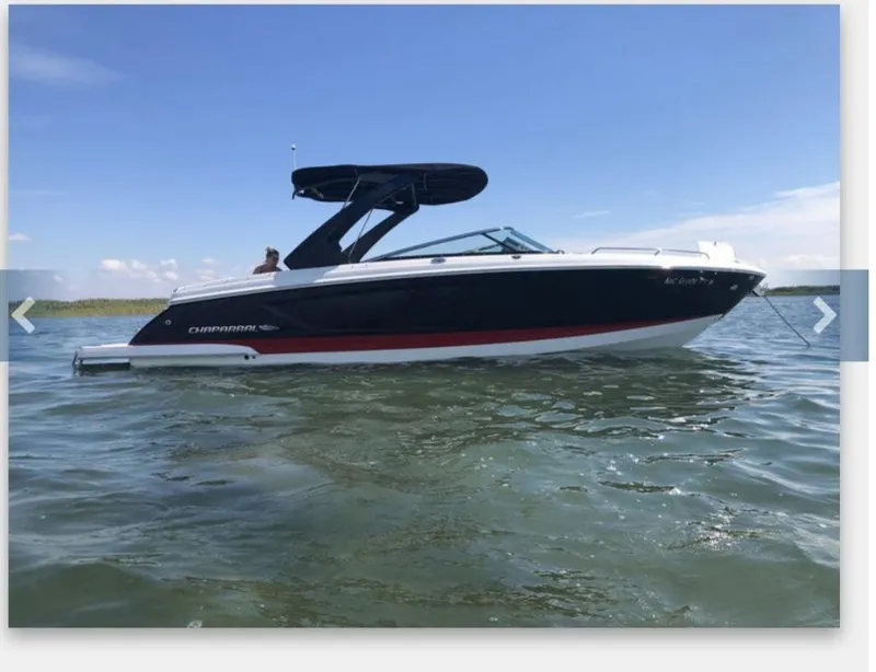 Slide: The Image of 2017 Chaparral 287 SSX boat on calm water. - 4