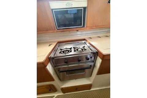 Slide: The Image of 2003 Morgan/Catalina 381 CC yacht kitchen with stove and oven. - 10