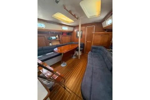 Slide: The Image of Interior of 2003 Morgan/Catalina 381 CC sailboat with wooden flooring and seating area. - 17