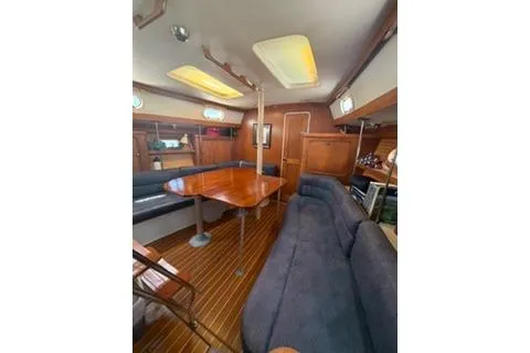 Slide: The Image of Interior of 2003 Morgan/Catalina 381 CC sailboat with wooden table and seating. - 18