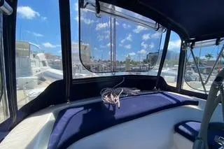 Slide: The Image of Interior view of a 2003 Morgan/Catalina 381 CC boat with blue seating. - 23