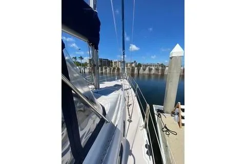 Slide: The Image of 2003 Morgan/Catalina 381 CC sailboat docked at marina under clear blue sky. - 24