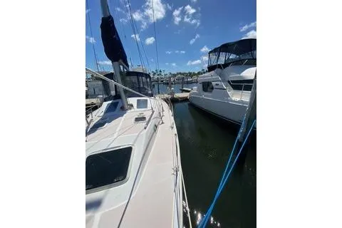 Slide: The Image of 2003 Morgan/Catalina 381 CC sailboat docked at marina under clear blue sky. - 28
