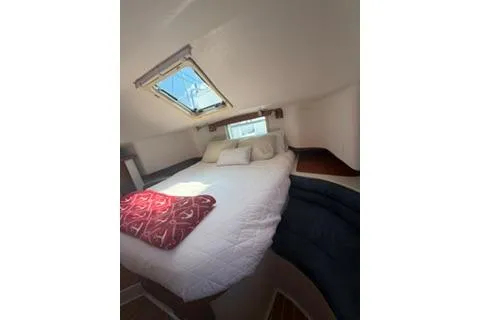 Slide: The Image of Cozy cabin interior of 2003 Morgan/Catalina 381 CC with skylight and bedding. - 3