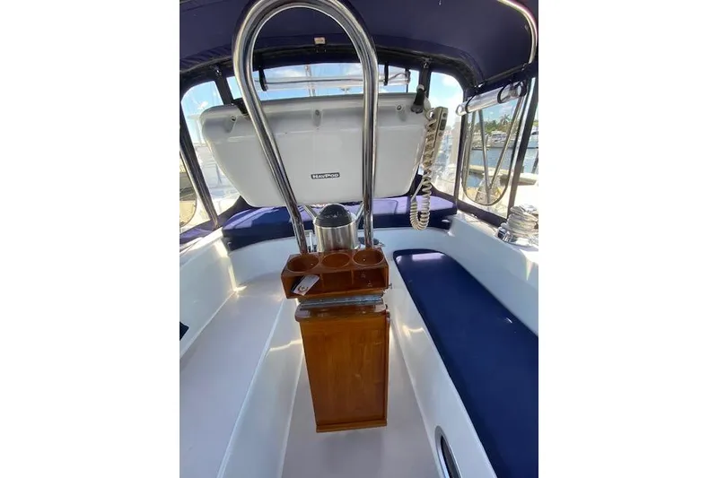 Slide: The Image of 2003 Morgan/Catalina 381 CC boat interior with seating and helm station. - 33