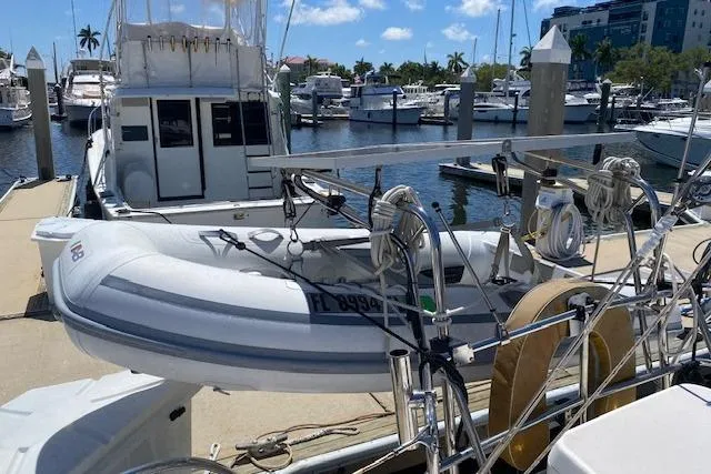 Slide: The Image of 2003 Morgan/Catalina 381 CC docked with inflatable dinghy at marina. - 36