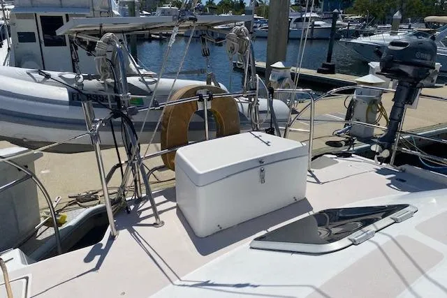 Slide: The Image of 2003 Morgan/Catalina 381 CC yacht deck with storage box and marina view. - 37