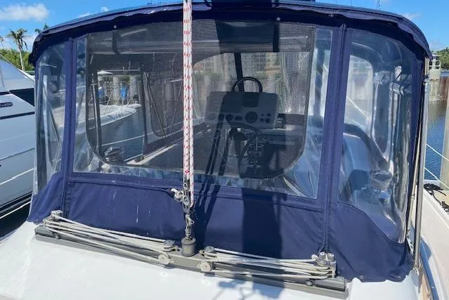 Slide: The Image of 2003 Morgan/Catalina 381 CC sailboat cockpit with blue canvas enclosure. - 38
