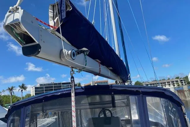 Slide: The Image of Sailboat Morgan/Catalina 381 CC, 2003 model, with blue sail cover and clear sky background. - 39