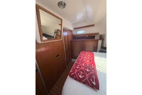 Slide: The Image of Cozy cabin interior of 2003 Morgan/Catalina 381 CC with nautical-themed decor. - 4