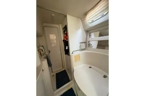 Slide: The Image of 2003 Morgan/Catalina 381 CC yacht bathroom with modern fixtures and ample storage space. - 6
